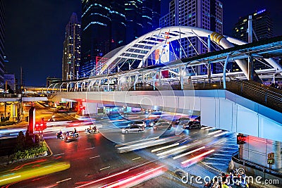 Public sky walk and traffic at Chong Nonsi sky train station at Editorial Stock Photo